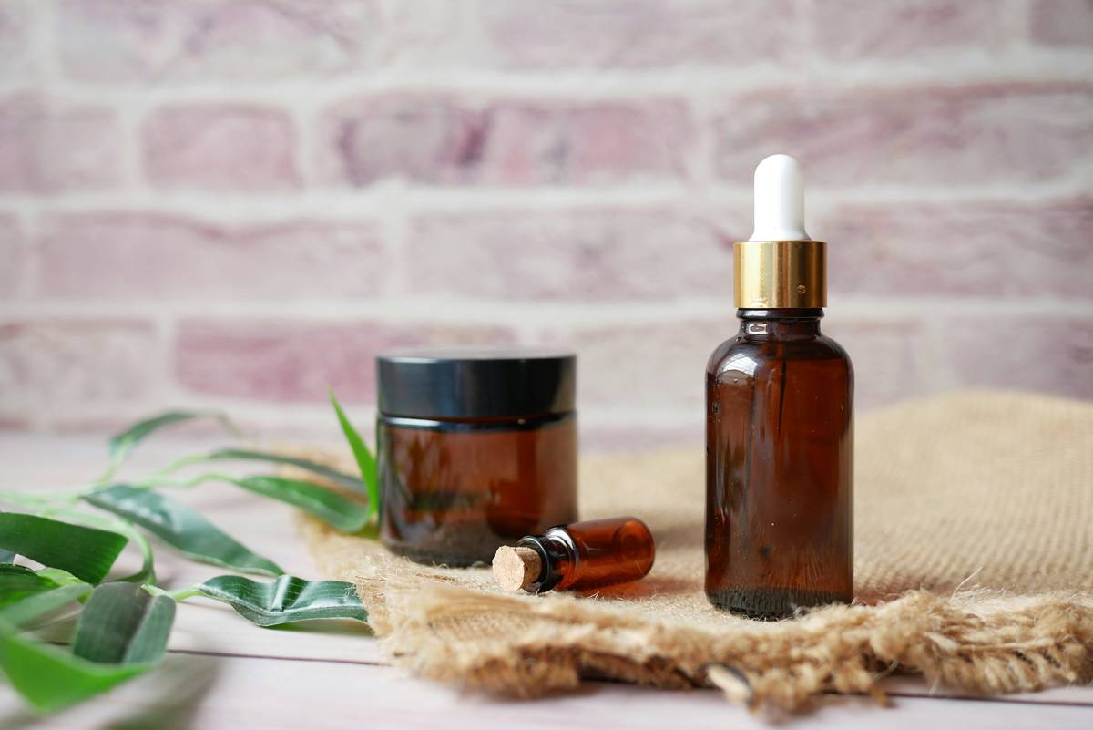 Natural skincare lotion b oil moisturizer applied to hand showing dewy, hydrated skin